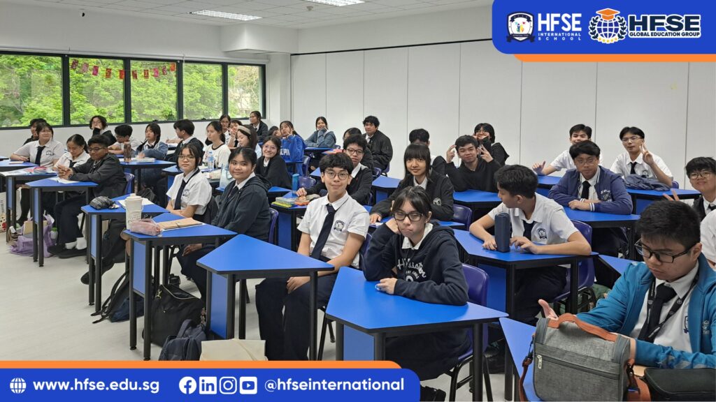 A group of students sitting in their classroom.