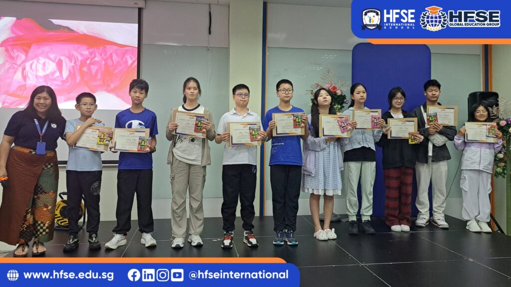 A group of students proudly holding their certificates.