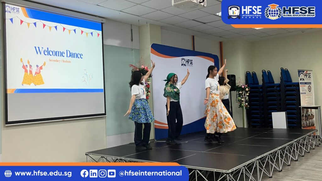 A group of students performing a dance on stage.