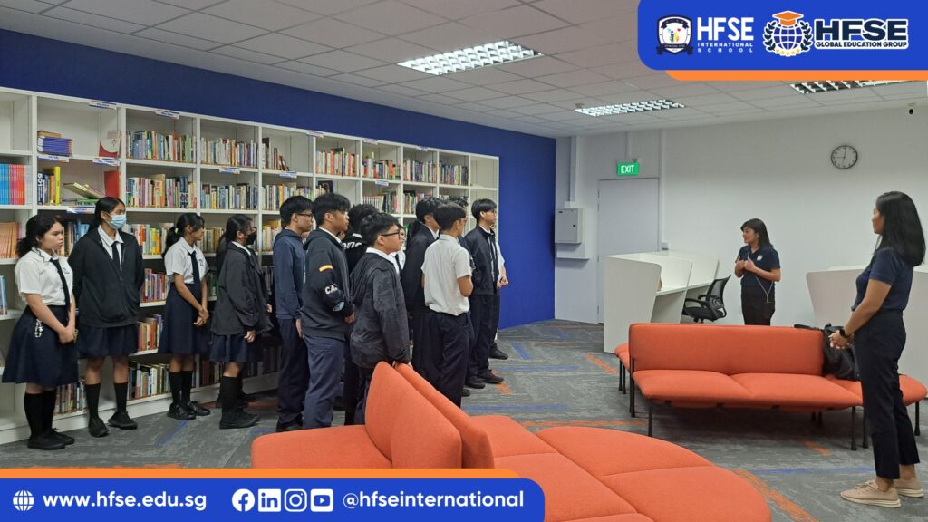 A group of secondary students in a library.