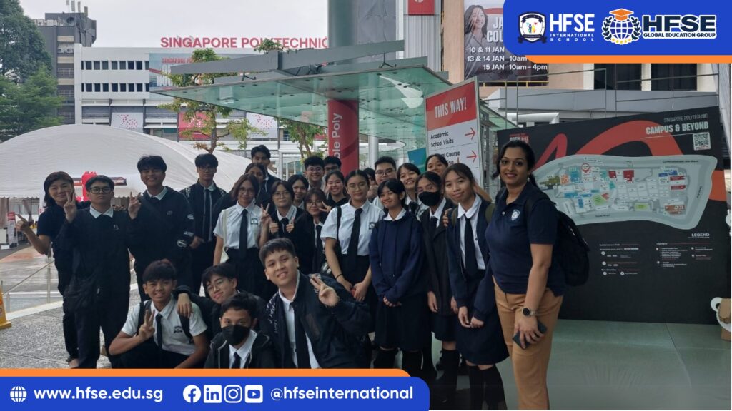 A group of secondary students in Singapore posing for a picture in front of Singapore Polytechnic.