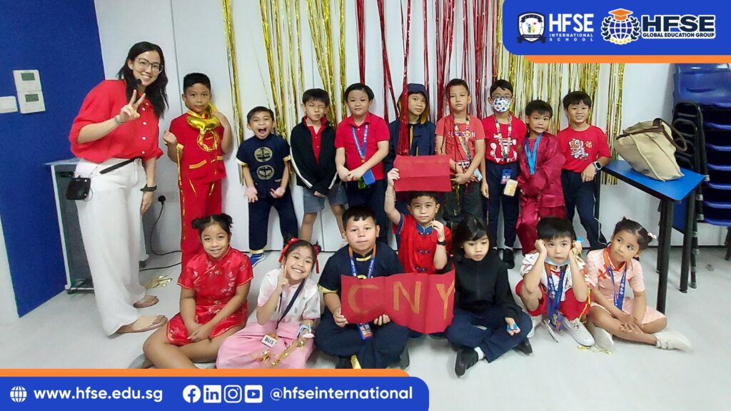 A group of students in Singapore celebrating Chinese New Year with their teacher.